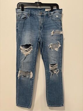Distressed Women's Blue Denim Jeans with Embellished Rips